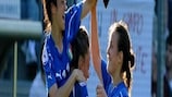 Katia Coppola is hoisted aloft by Italy captain Martina Rosucci after scoring the only goal in a 1-0 win