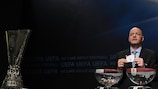 UEFA general secretary Gianni Infantino conducting the draw beside the UEFA Europa League trophy
