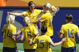 Lotta Schelin celebrates with her Sweden team-mates after scoring against Australia