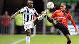 Rennes' Yacine Brahimi (right) contests a high ball with Pablo Armero