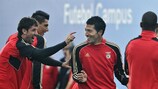 Benfica's Ezequiel Garay shares a joke in training on Tuesday