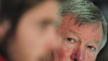 Sir Alex Ferguson listens to David de Gea speak to the media on Wednesday