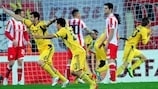 Metalist players celebrate after their late comeback