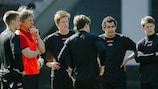 Gertjan Verbeek, in the orange bib, talks to his players in training on Wednesday