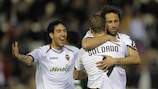 Valencia's Jonas embraces team-mate Roberto Soldado after scoring against Betis