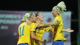 Elin Rubensson is mobbed by her team-mates after giving Sweden the lead