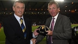 SFA president Campbell Ogilvie presenting Kenny Dalglish with his UEFA award for winning 100 caps