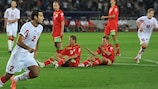 Georgia's Tornike Okriashvili (left) reacts after scoring the only goal