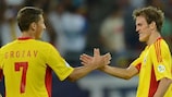 Costin Lazăr (right) celebrates scoring Romania's second goal