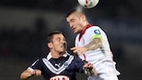 Bordeaux goalscorer Ludovic Obraniak competes with Mathieu Debuchy