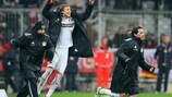 Stefan Kiessling, Gonzalo Castro and Julio Fernandez celebrate Leverkusen's win from the bench