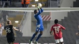 Hapoel goalkeeper Édel Apoula collects under pressure from Plzeň's Daniel Kolář