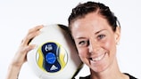 Sweden's Lotta Schelin gets a first look at the 2013 UEFA Women's EURO official adidas match ball