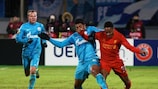 Zenit's Hulk and Liverpool's Raheem Sterling jostle in the first leg