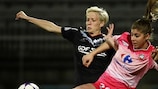 Lyon's Megan Rapinoe (left) challenges Juvisy's Camille Catala during the first leg