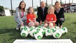 IFA women's football manager Sara Booth (left), UEFA HatTrick Committee chairman Allan Hansen (centre) and UEFA women's football development manager Emily Shaw join youngsters in Enniskillen.