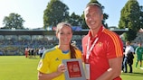 Patrik Andersson (right) presents compatriot Kosovare Asllani with her player of the match award after Sweden's quarter-final win