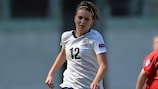 Melissa Lawley (L) runs clear of Wales midfielder Rachel Hignett