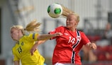 Mimmi Larsson of Sweden vies with Norway's Guro Bergsvand