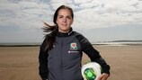 Wales striker cum media officer Gwennan Harries on Swansea beach by the team's tournament HQ