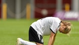 Theresa Panfil sinks to the turf after Germany's 2-1 defeat