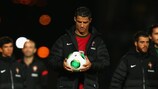 Cristiano Ronaldo receives the match ball after scoring his first international hat-trick in Belfast