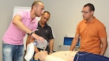 Practical work at the FDEP seminar in Malta, with Dr David Attard, Malta FA doctor (centre) looking on.
