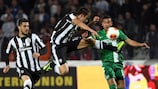 PAOK's Miguel Vítor leaps to meet the ball against Maccabi Haifa