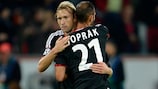 Leverkusen's Simon Rolfes is congratulated on his opening goal by Ömer Toprak