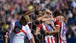 Diego Costa is mobbed by his Atlético team-mates