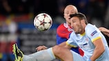 Steaua striker Federico Piovaccari feels the force of Basel's Ivan Ivanov