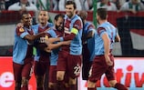 Olcan Adın is mobbed after his goal for Trabzonspor