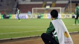 A ball kid watches one of Maccabi Haifa's UEFA Europa League games