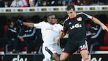 Eintracht's Constant Djakpa puts a challenge in on Giulio Donati