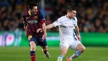 James Milner holds off Lionel Messi during the teams' round of 16 tie last season
