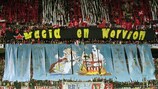 Los aficionados del Sevilla, con una pancarta