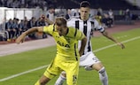 Tottenham's Harry Kane in action with Partizan's Danilo Pantić (right)