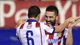 Koke celebrates with Arda Turan after scoring during their group stage against Malmö