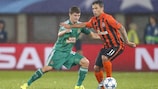 Rapid Wien's Stephan Auer is held off by Shakhtar's Marlos