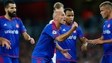 Esteban Cambiasso cajoled a match-winning performance from his Olympiacos team-mates against Arsenal