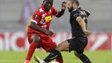 Rubin midfielder Gökdeniz Karadeniz tries to halt Sion's Ebenezer Assifuah