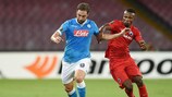 Napoli forward Gonzalo Higuaín shoulder to shoulder with Club Brugge's Boli Bolingoli Mbombo