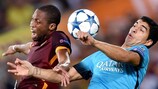 Seydou Keita and Luis Suárez dispute a high ball in Rome