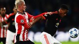 PSV's Maxime Lestienne gets to grips with United forward Anthony Martial