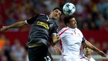 Lars Stindl and Sevilla's José Antonio Reyes jump for a high ball on matchday one