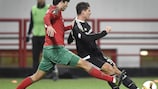 Lokomotiv defender Vedran Ćorluka challenges Beşiktaş forward Mario Gomez