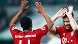 Douglas Costa and Xabi Alonso celebrate during Bayern's win