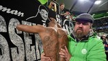 Naldo celebrates with fans at the end of Wolfsburg's win against United