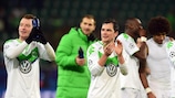 Wolfsburg players celebrate their qualification for the round of 16