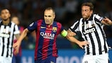 Barcelona's Andrés Iniesta vies with Claudio Marchisio of Juventus